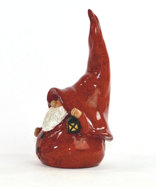 Bilden visar Tomte figurin med röd stor luva, skägg och lykta sida
